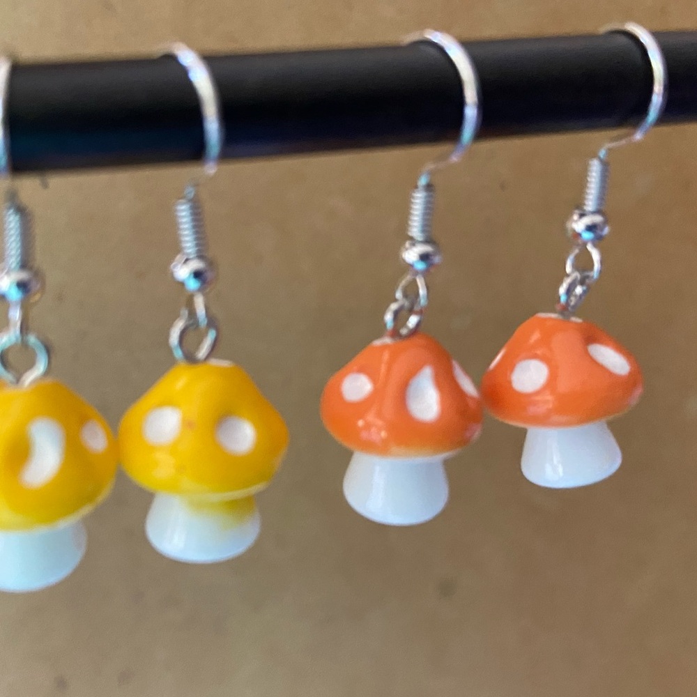 Orange mushroom pendant charm earrings. Small and dainty.